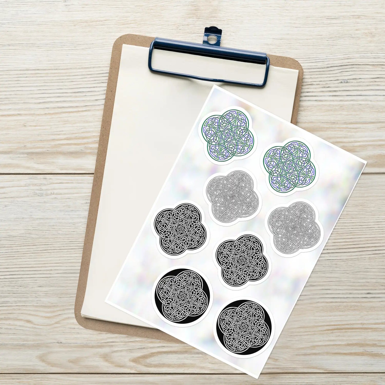 A Xigfireon Celtic knot sticker sheet consisting of 8 individual Reach Of The Spirit stickers, 2 each of the Living Colour, Black & White Hollow, Black & White Solid, and Black & White Circle iterations. The Reach Of The Spirit Celtic knot represents the Earth.