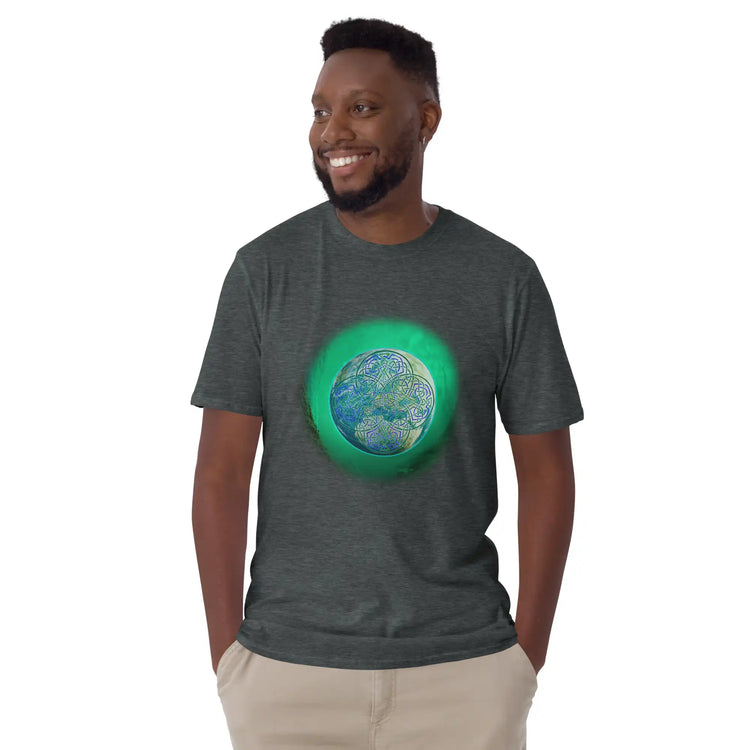 A young man wearing a dark heather Xigfireon graphic t-shirt featuring the Deep Forest iteration of the Reach Of The Spirit Celtic knot design. The Reach Of The Spirit Celtic knot represents Mother Earth.
