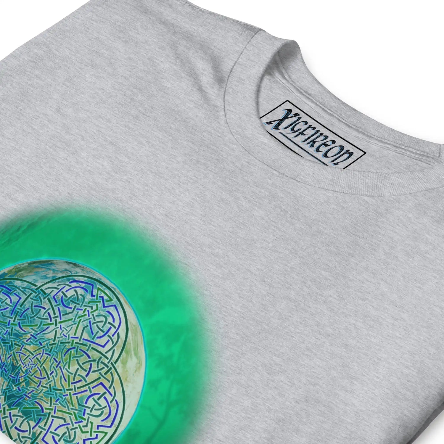 A close-up of a sport grey Xigfireon graphic t-shirt featuring the Deep Forest iteration of the Reach Of The Spirit Celtic knot design. The Reach Of The Spirit Celtic knot represents Mother Earth.