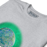 A close-up of a sport grey Xigfireon graphic t-shirt featuring the Deep Forest iteration of the Reach Of The Spirit Celtic knot design. The Reach Of The Spirit Celtic knot represents Mother Earth.