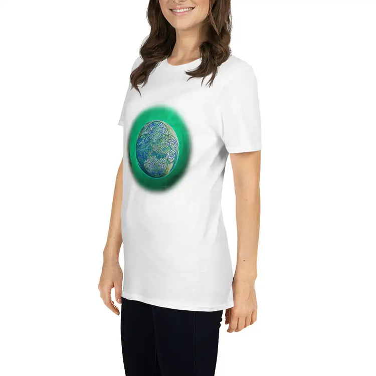 A young woman wearing a white Xigfireon graphic t-shirt featuring the Deep Forest iteration of the Reach Of The Spirit Celtic knot design. The Reach Of The Spirit Celtic knot represents Mother Earth.