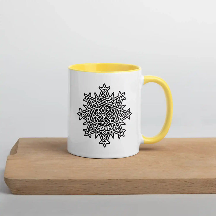 A Xigfireon white ceramic 11oz mug featuring the Black & White Solid iteration of the Morning Star Fire Celtic knot design, with yellow handle and inside. This Celtic knot symbolizes Father Sun.