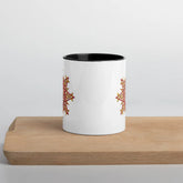 The front side of a Xigfireon white ceramic 11oz mug featuring the Fire Colour iteration of the Morning Star Fire Celtic knot design, with black handle and inside. This Celtic knot symbolizes Father Sun.