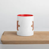 The front side of a Xigfireon white ceramic 11oz mug featuring the Fire Colour iteration of the Morning Star Fire Celtic knot design, with red handle and inside. This Celtic knot symbolizes Father Sun.