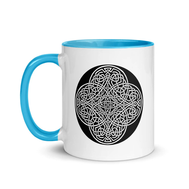 A Xigfireon white ceramic 11oz mug featuring the Black & White Circle iteration of the Reach Of The Spirit Celtic knot design, with blue handle and inside. This Celtic knot symbolizes Mother Earth.