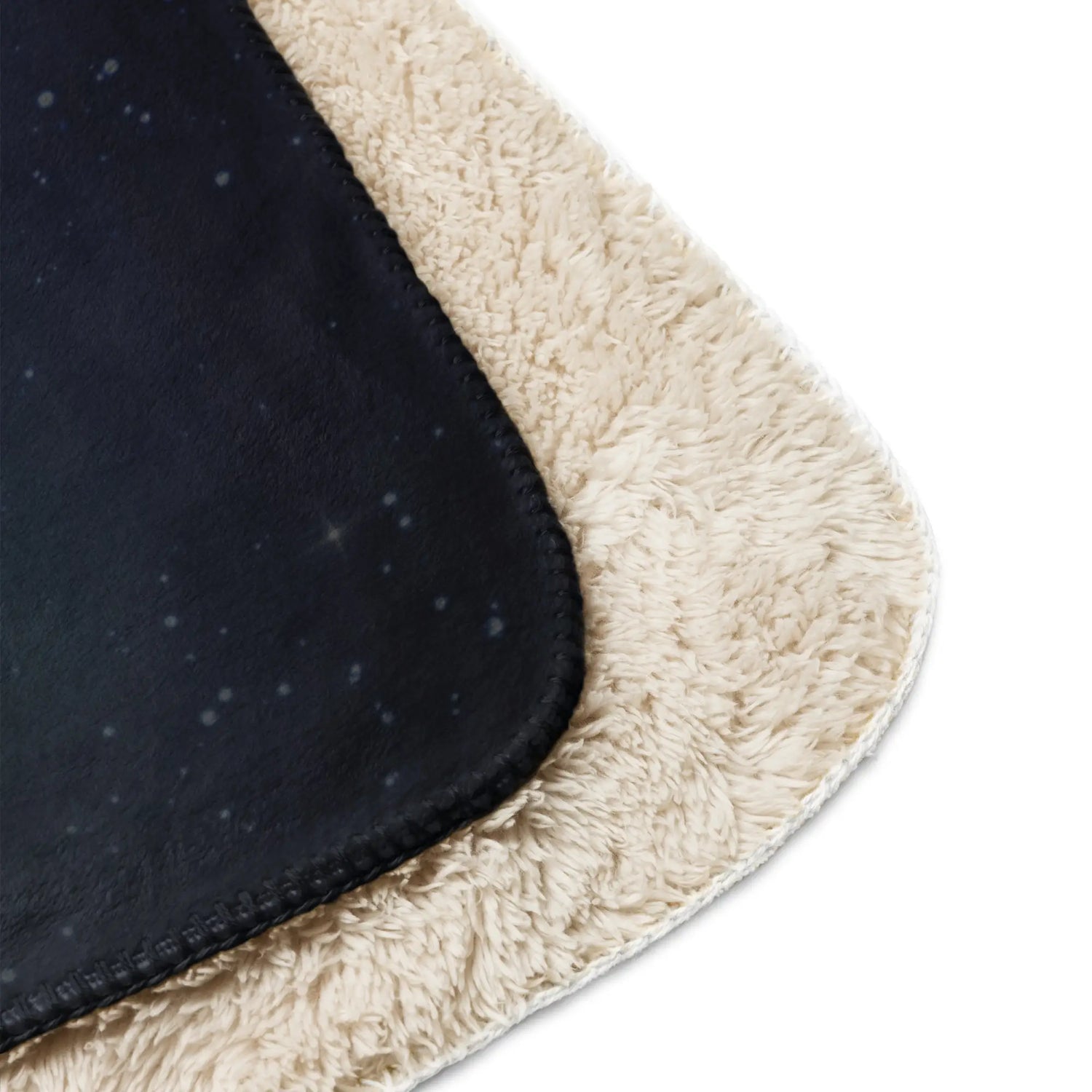  A close-up of the corners of a 37 inch by 57 inch Xigfireon sublimated sherpa blanket featuring the Eclipsed iteration of the Morning Star Fire Celtic knot design. Inspired by the 2023 Annular Solar Eclipse.