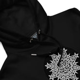 A close-up view of a black Xigfireon graphic eco hoodie featuring the Black & White Circle iteration of the Morning Star Fire Celtic knot design. The Morning Star Fire Celtic knot symbolizes the Sun.