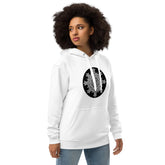 A young woman wearing a white Xigfireon graphic eco hoodie featuring the Black & White Circle iteration of the Morning Star Fire Celtic knot design. The Morning Star Fire Celtic knot symbolizes the Sun.