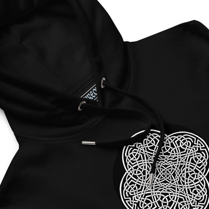 A close-up view of a black Xigfireon graphic eco hoodie featuring the Black &amp; White Circle iteration of the Reach Of The Spirit Celtic knot design. The Reach Of The Spirit Celtic knot represents our glorious Mother Earth.