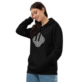 A young woman wearing a black Xigfireon graphic eco hoodie featuring the Black & White Circle iteration of the Reach Of The Spirit Celtic knot design. The Reach Of The Spirit Celtic knot represents our glorious Mother Earth.