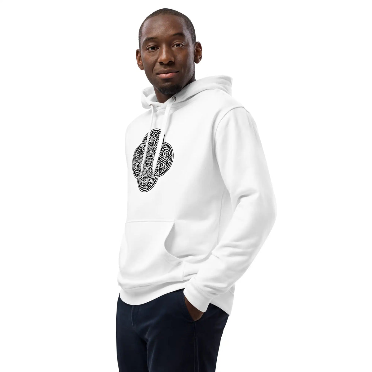 A young man wearing a white Xigfireon graphic eco hoodie featuring the Black &amp; White Solid iteration of the Reach Of The Spirit Celtic knot design. The Reach Of The Spirit Celtic knot symbolizes our magnificent Mother Earth.