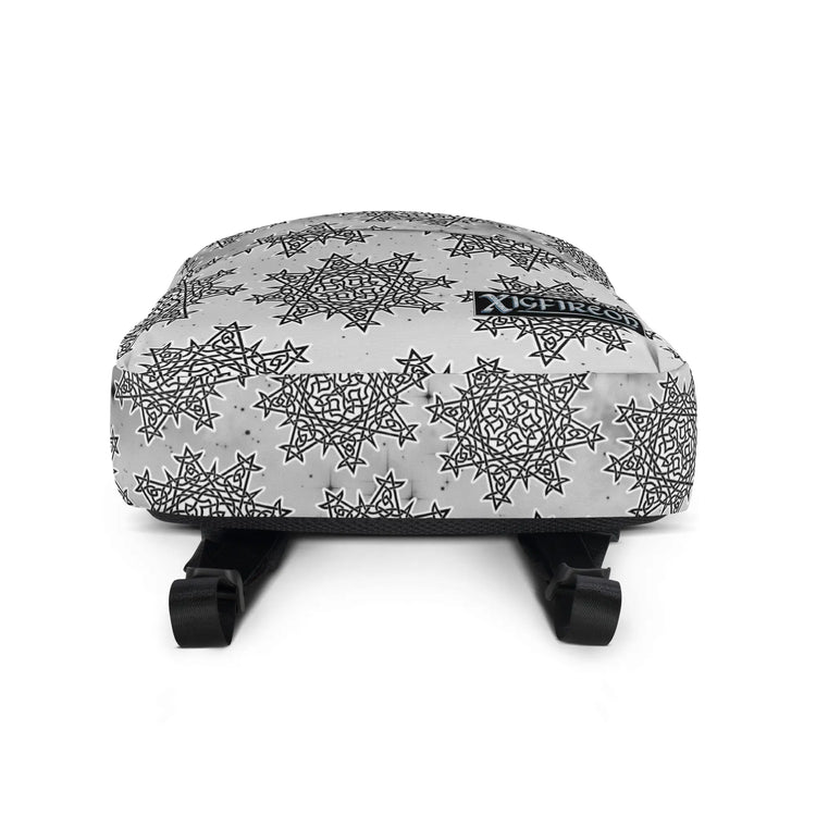A view of the bottom of a Xigfireon graphic backpack featuring the Black & White Solid Cosmos Inverted iteration of the `Morning Star Fire` Celtic knot pattern. The `Morning Star Fire` Celtic knot symbolizes the Sun.
