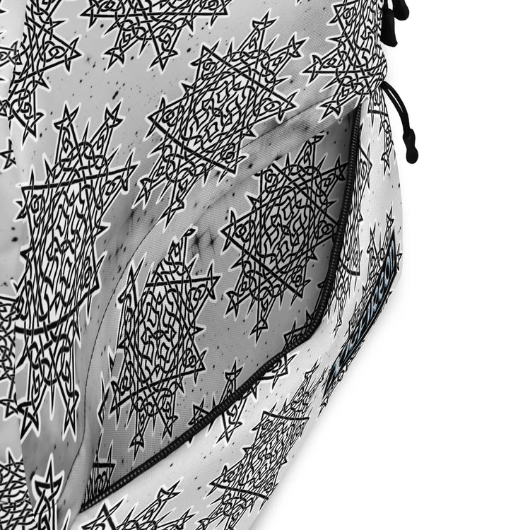 A view of the inside pocket of a Xigfireon graphic backpack featuring the Black & White Solid Cosmos Inverted iteration of the `Morning Star Fire` Celtic knot pattern.