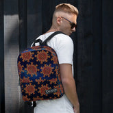 A student carrying a Xigfireon graphic backpack featuring the Fire Colour Cosmos iteration of the `Morning Star Fire` Celtic knot pattern. The `Morning Star Fire` Celtic knot symbolizes the Sun.