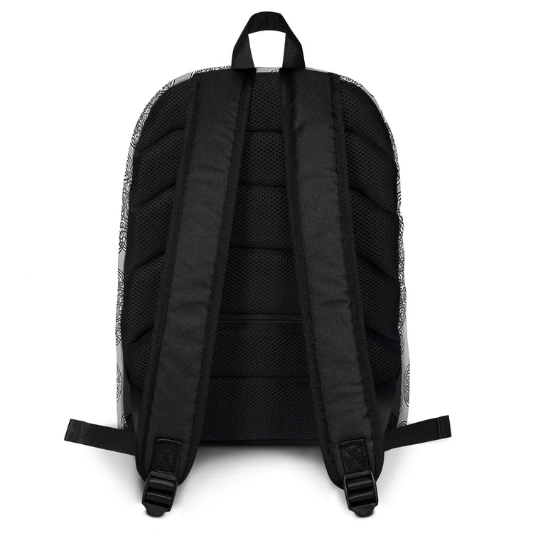 A view of the straps on a Xigfireon graphic backpack featuring the Black & White Solid Forest Inverted iteration of the `Reach Of The Spirit` Celtic knot pattern. The `Reach Of The Spirit` Celtic knot represents Mother Earth.