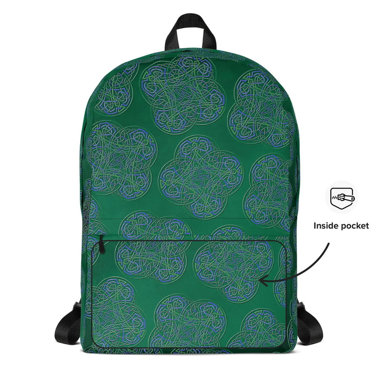 A view of the back of a Xigfireon graphic backpack featuring the Living Colour Forest Inverted iteration of the `Reach Of The Spirit` Celtic knot pattern. A simple graphic and arrow indicate the location of the inside pocket.