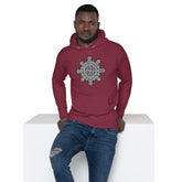 A young man wearing a maroon Xigfireon graphic hoodie featuring the Black & White Solid iteration of the Morning Star Fire Celtic knot design. The Morning Star Fire Celtic knot represents the Sun.