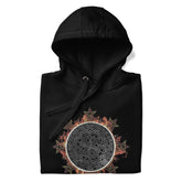 A folded black Xigfireon graphic hoodie featuring the Eclipsed iteration of the Morning Star Fire Celtic knot design, inspired by the 2023 Annular Solar Eclipse.
