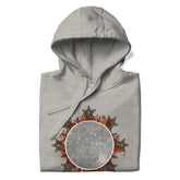 A folded carbon grey Xigfireon graphic hoodie featuring the Eclipsed iteration of the Morning Star Fire Celtic knot design, inspired by the 2023 Annular Solar Eclipse.