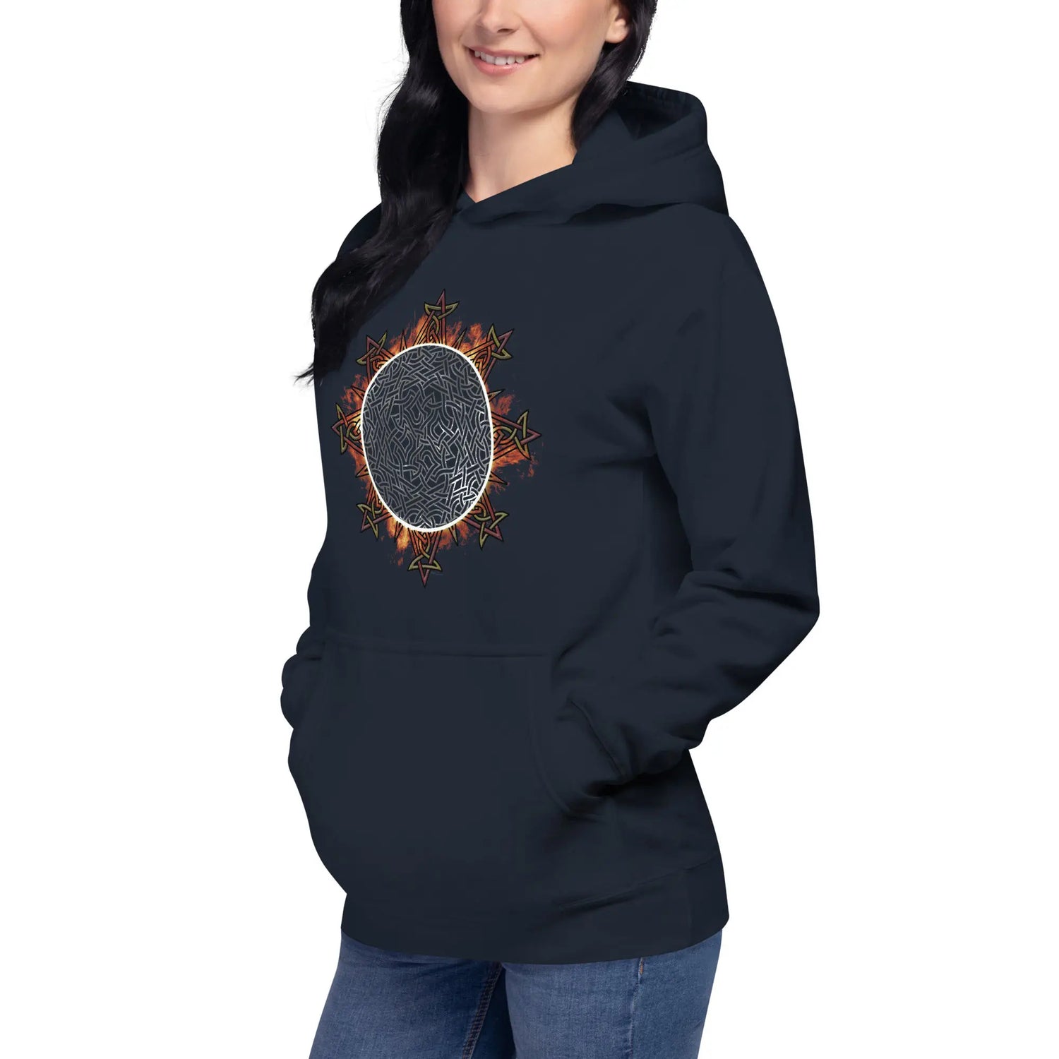 A young woman wearing a navy blazer blue Xigfireon graphic hoodie featuring the Eclipsed iteration of the Morning Star Fire Celtic knot design, inspired by the 2023 Annular Solar Eclipse.