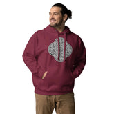 A young man wearing a maroon Xigfireon graphic hoodie featuring the Black & White Solid iteration of the Reach Of The Spirit Celtic knot design. The Reach Of The Spirit Celtic knot symbolizes the Earth.