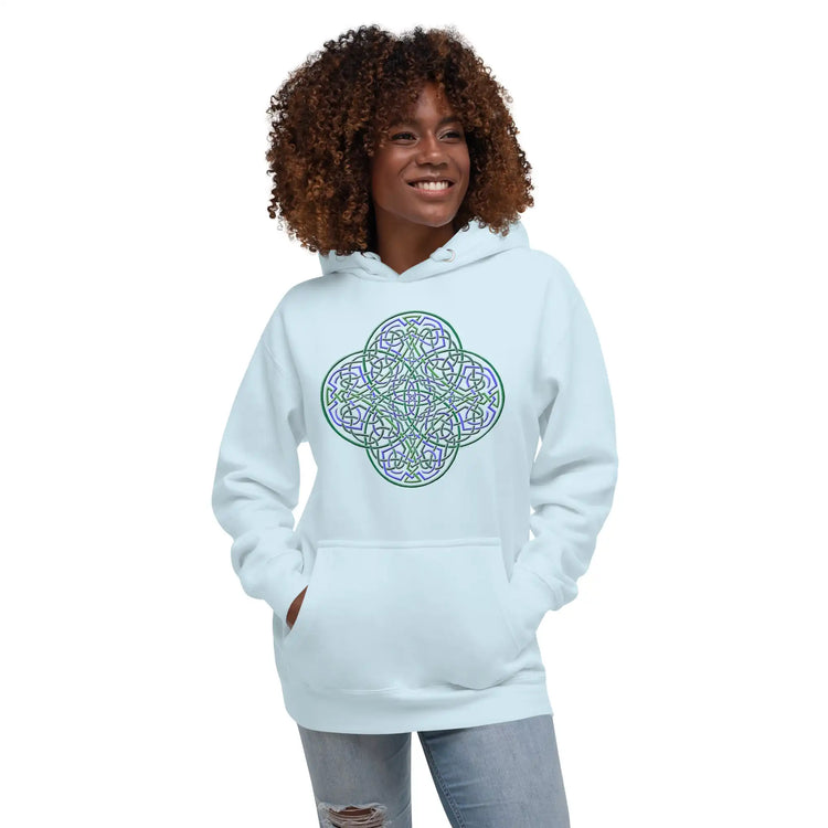 A young woman wearing a sky blue Xigfireon graphic hoodie featuring the Living Colour iteration of the Reach Of The Spirit Celtic knot design. The Reach Of The Spirit Celtic knot represents the Earth.