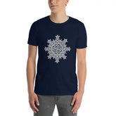 A young man wearing a navy blue Xigfireon graphic t-shirt featuring the Black & White Hollow iteration of the Morning Star Fire Celtic knot design. The Morning Star Fire Celtic knot represents Father Sun and the eternal Cosmic Light.