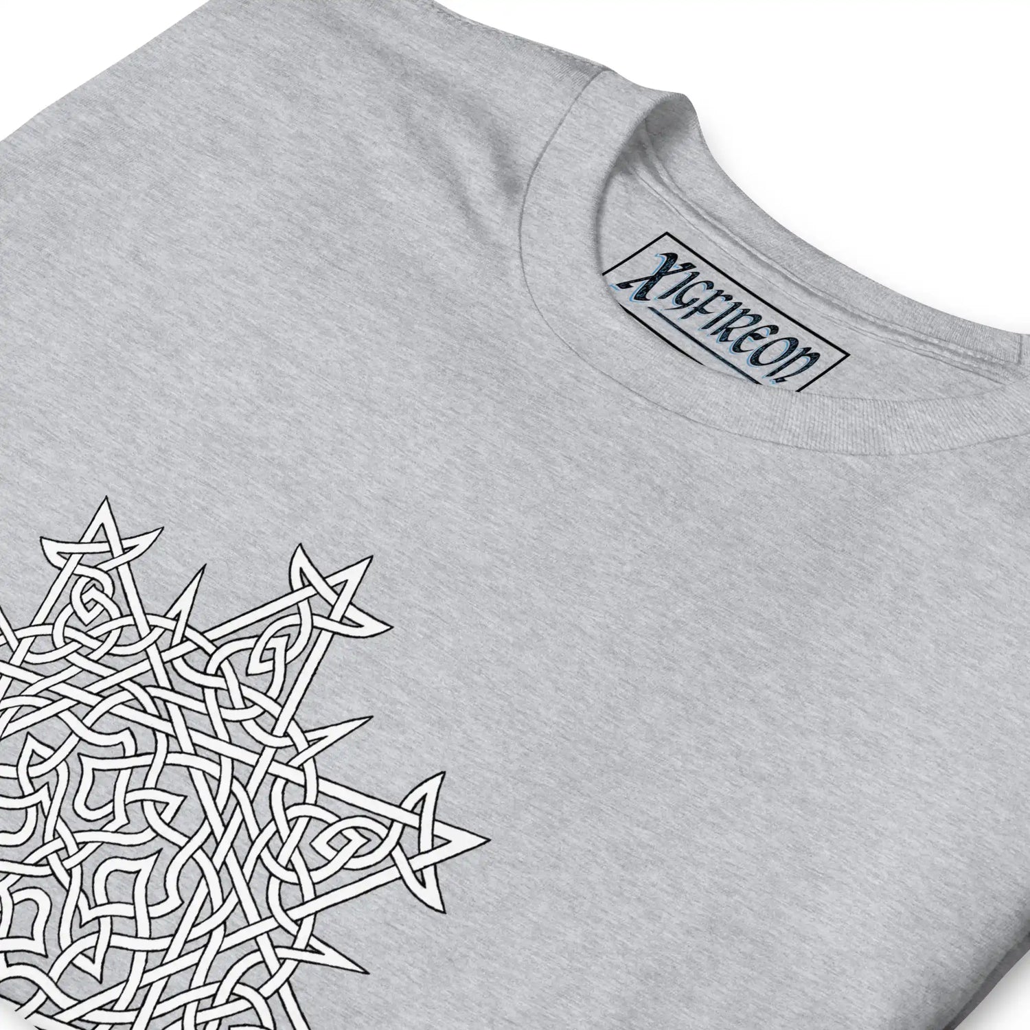 A close-up view of a sport grey Xigfireon graphic t-shirt featuring the Black & White Hollow iteration of the Morning Star Fire Celtic knot design. The Morning Star Fire Celtic knot symbolizes the Sun.