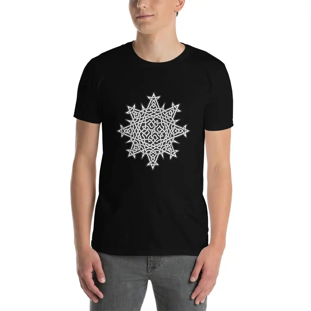 A young man wearing a black Xigfireon graphic t-shirt featuring the Black & White Solid iteration of the Morning Star Fire Celtic knot design. The Morning Star Fire Celtic knot symbolizes the Sun.