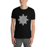 A young man wearing a black Xigfireon graphic t-shirt featuring the Black & White Solid iteration of the Morning Star Fire Celtic knot design. The Morning Star Fire Celtic knot symbolizes the Sun.