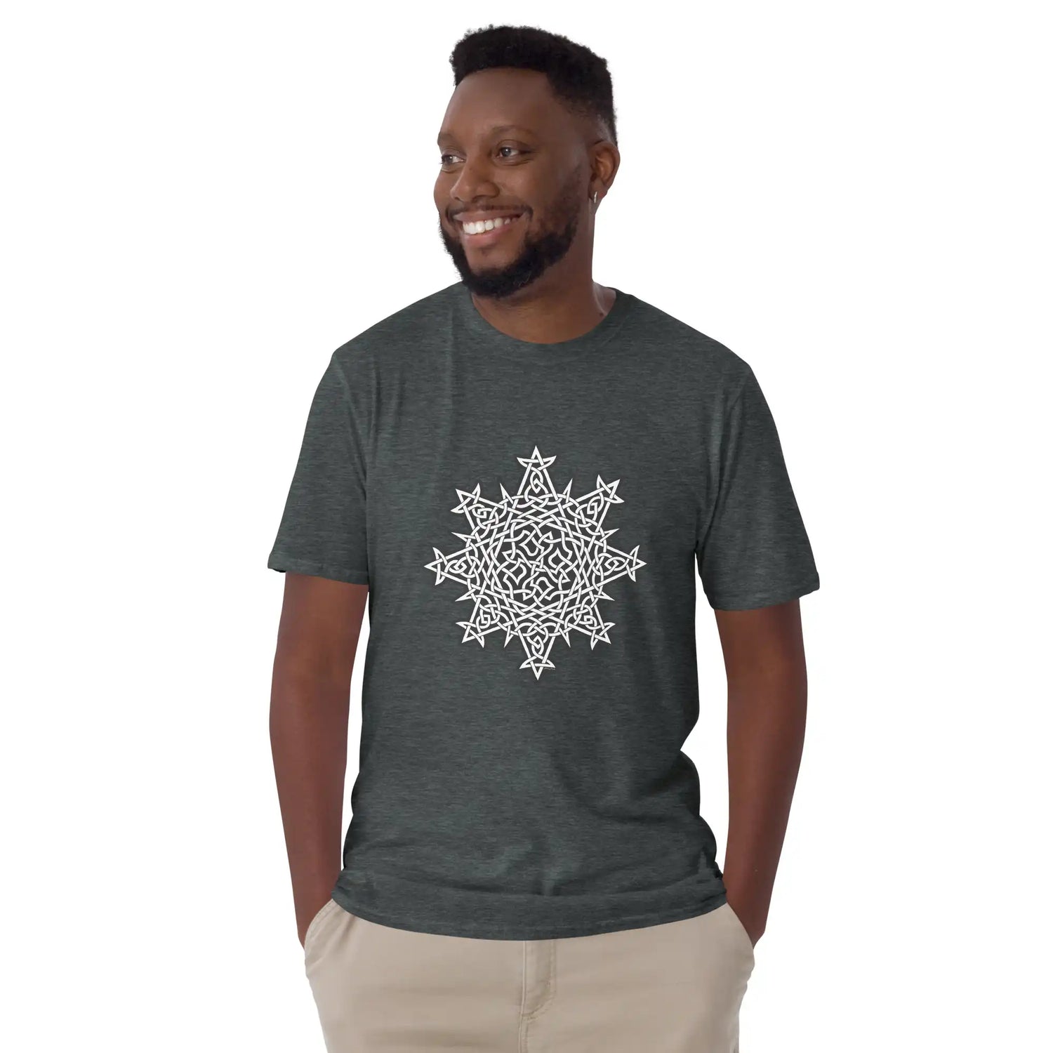 A young man wearing a dark heather Xigfireon graphic t-shirt featuring the Black & White Solid iteration of the Morning Star Fire Celtic knot design. The Morning Star Fire Celtic knot symbolizes the Sun.