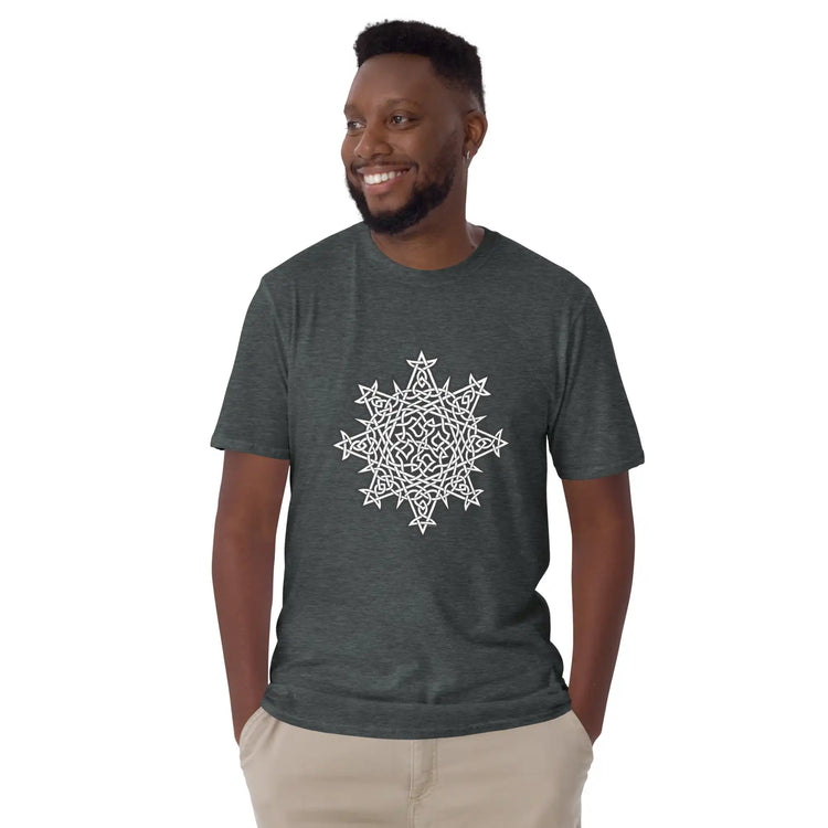 A young man wearing a dark heather Xigfireon graphic t-shirt featuring the Black & White Solid iteration of the Morning Star Fire Celtic knot design. The Morning Star Fire Celtic knot symbolizes the Sun.