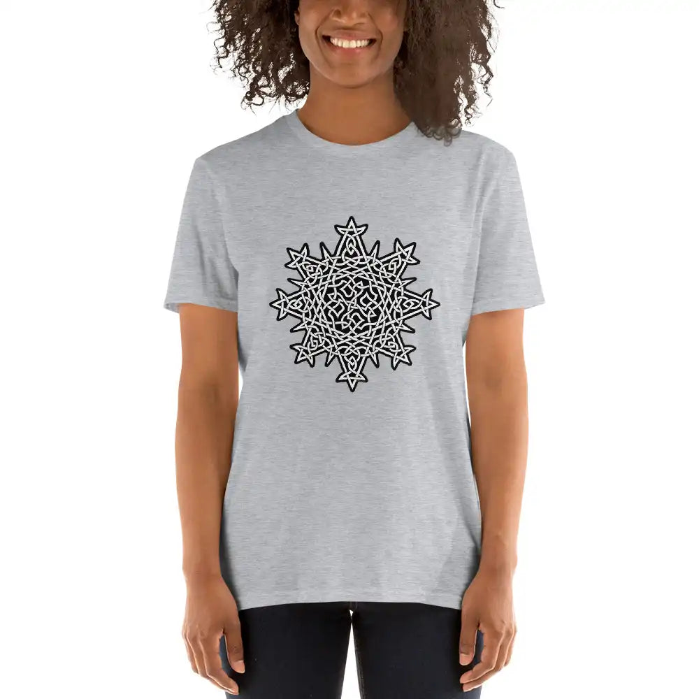A young woman wearing a sport grey Xigfireon graphic t-shirt featuring the Black & White Solid iteration of the Morning Star Fire Celtic knot design. The Morning Star Fire Celtic knot represents Father Sun and the eternal Cosmic Light.