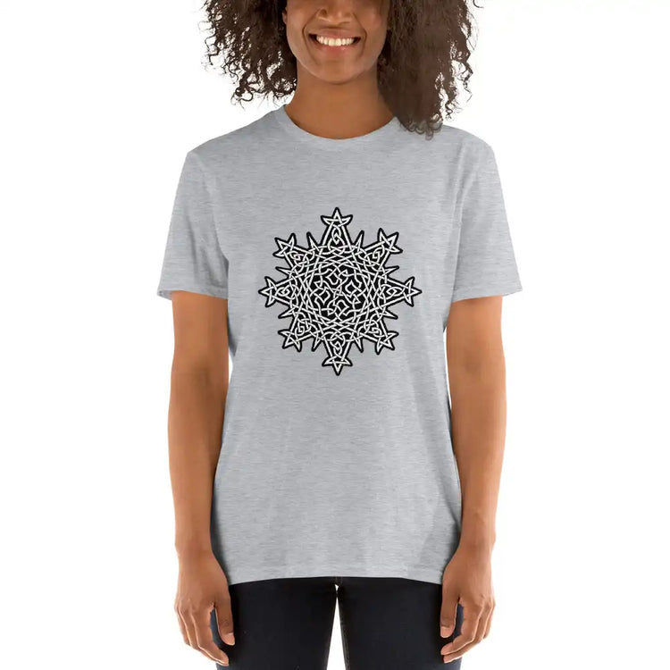 A young woman wearing a sport grey Xigfireon graphic t-shirt featuring the Black & White Solid iteration of the Morning Star Fire Celtic knot design. The Morning Star Fire Celtic knot represents Father Sun and the eternal Cosmic Light.