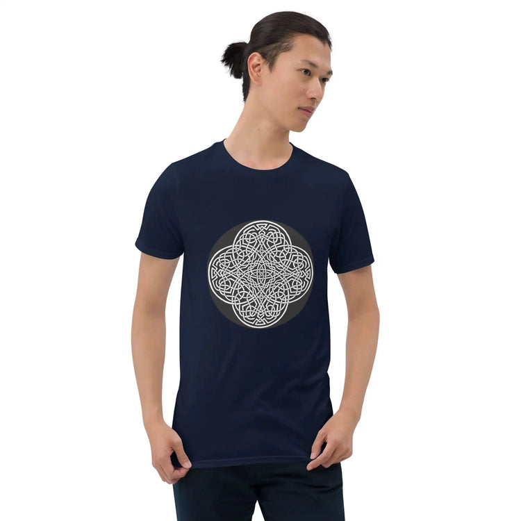 A young man wearing a navy blue Xigfireon graphic t-shirt featuring the Black & White Circle iteration of the Reach Of The Spirit Celtic knot design. The Reach Of The Spirit Celtic knot symbolizes Mother Earth.