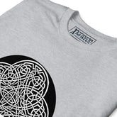 A close-up view of a sport grey Xigfireon graphic t-shirt featuring the Black & White Circle iteration of the Reach Of The Spirit Celtic knot design. The Reach Of The Spirit Celtic knot represents Mother Earth.