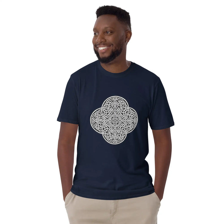 A young man wearing a navy blue Xigfireon graphic t-shirt featuring the Black & White Solid iteration of the Reach Of The Spirit Celtic knot design. The Reach Of The Spirit Celtic knot represents Mother Earth.