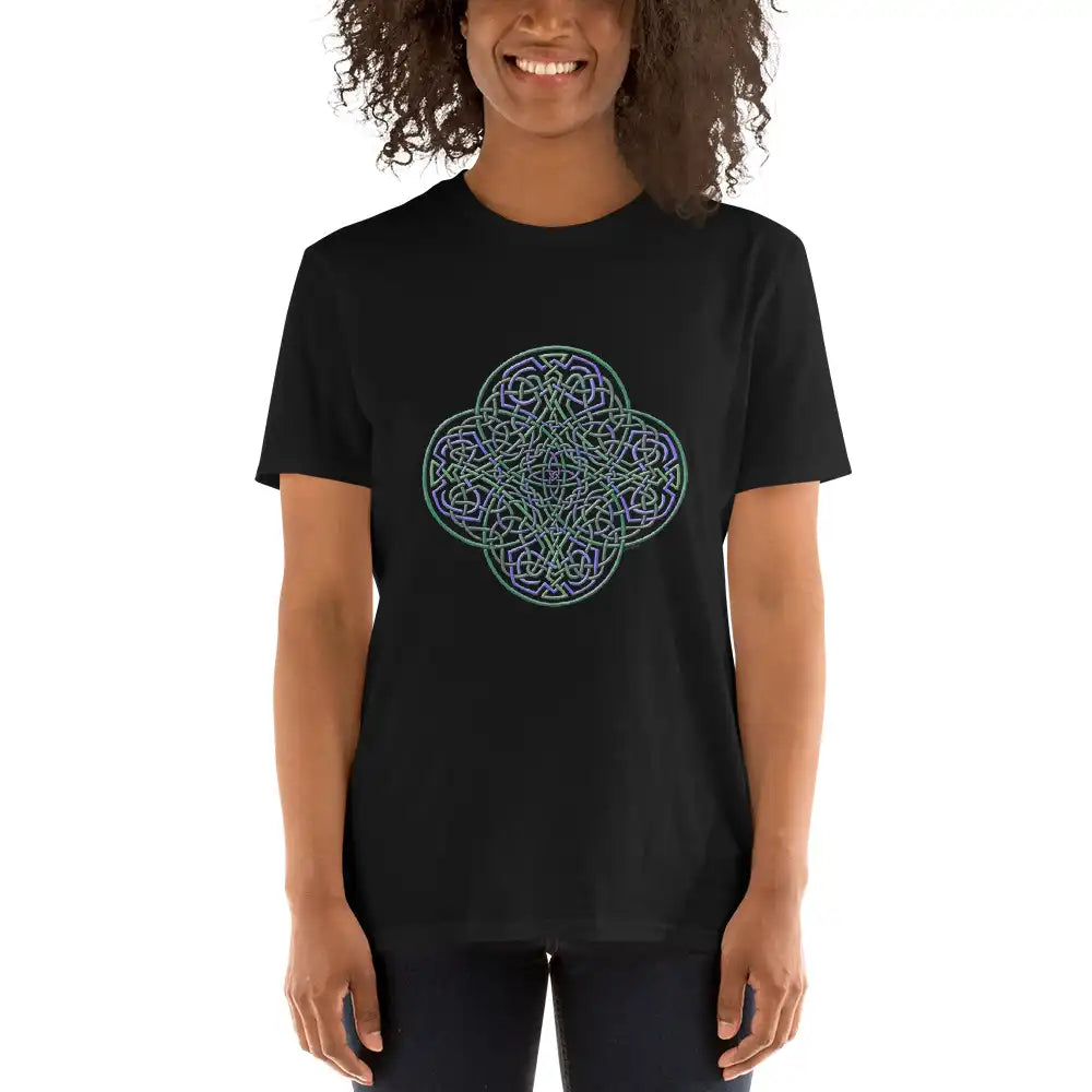 A young woman wearing a black Xigfireon graphic t-shirt featuring the Living Colour iteration of the Reach Of The Spirit Celtic knot design. The Reach Of The Spirit Celtic knot symbolizes Mother Earth.
