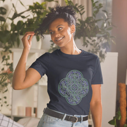 A young woman wearing a navy blue Xigfireon graphic t-shirt featuring the Living Colour iteration of the Reach Of The Spirit Celtic knot design. The Reach Of The Spirit Celtic knot symbolizes the Earth.