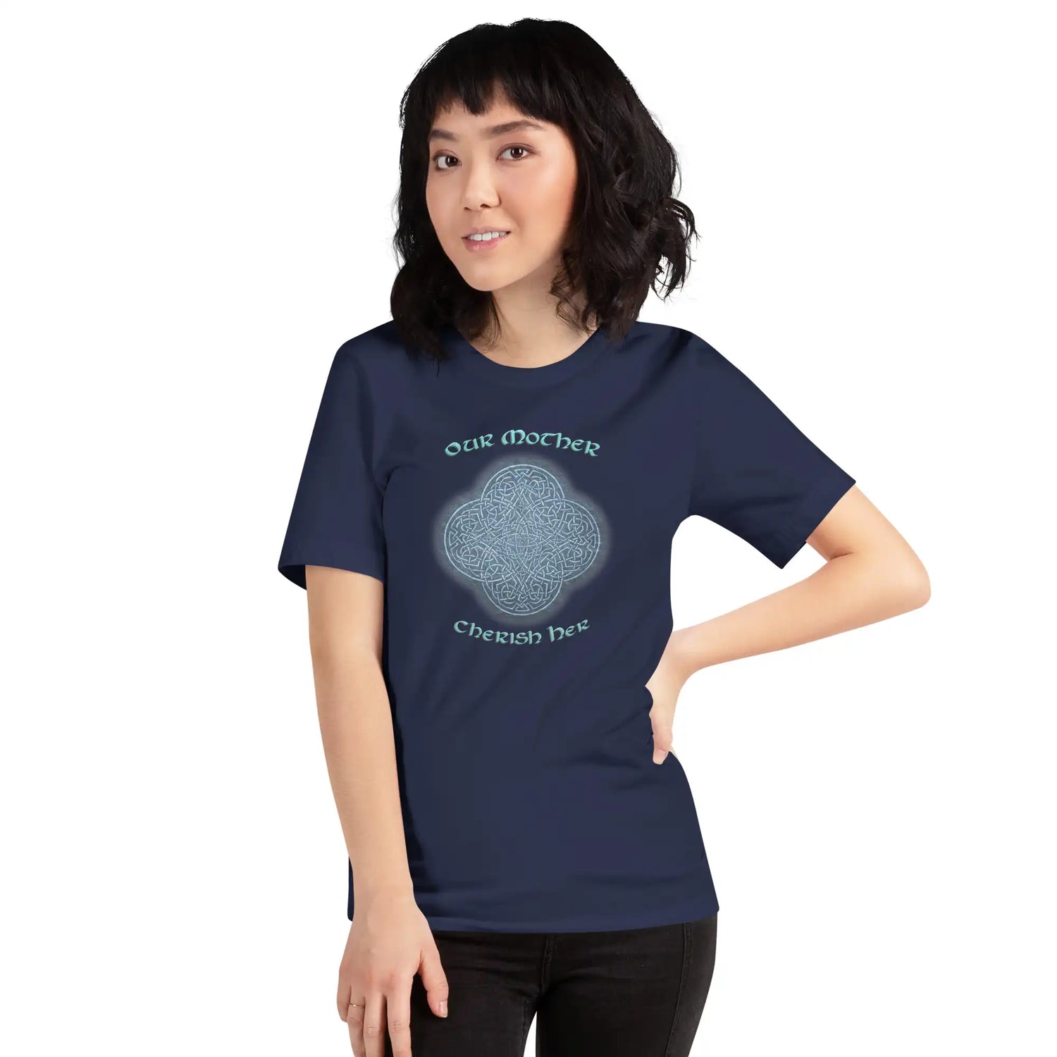 A young woman wearing a navy blue Xigfireon graphic t-shirt featuring the Blue Slate iteration of the `Reach Of The Spirit` Celtic knot design along with a message in a Celtic font: "Our Mother, Cherish Her".