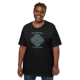 A young woman wearing a black Xigfireon graphic t-shirt featuring the Living Colour iteration of the Reach Of The Spirit Celtic knot design along with a message in a Celtic font: "Our Mother, Cherish Her".