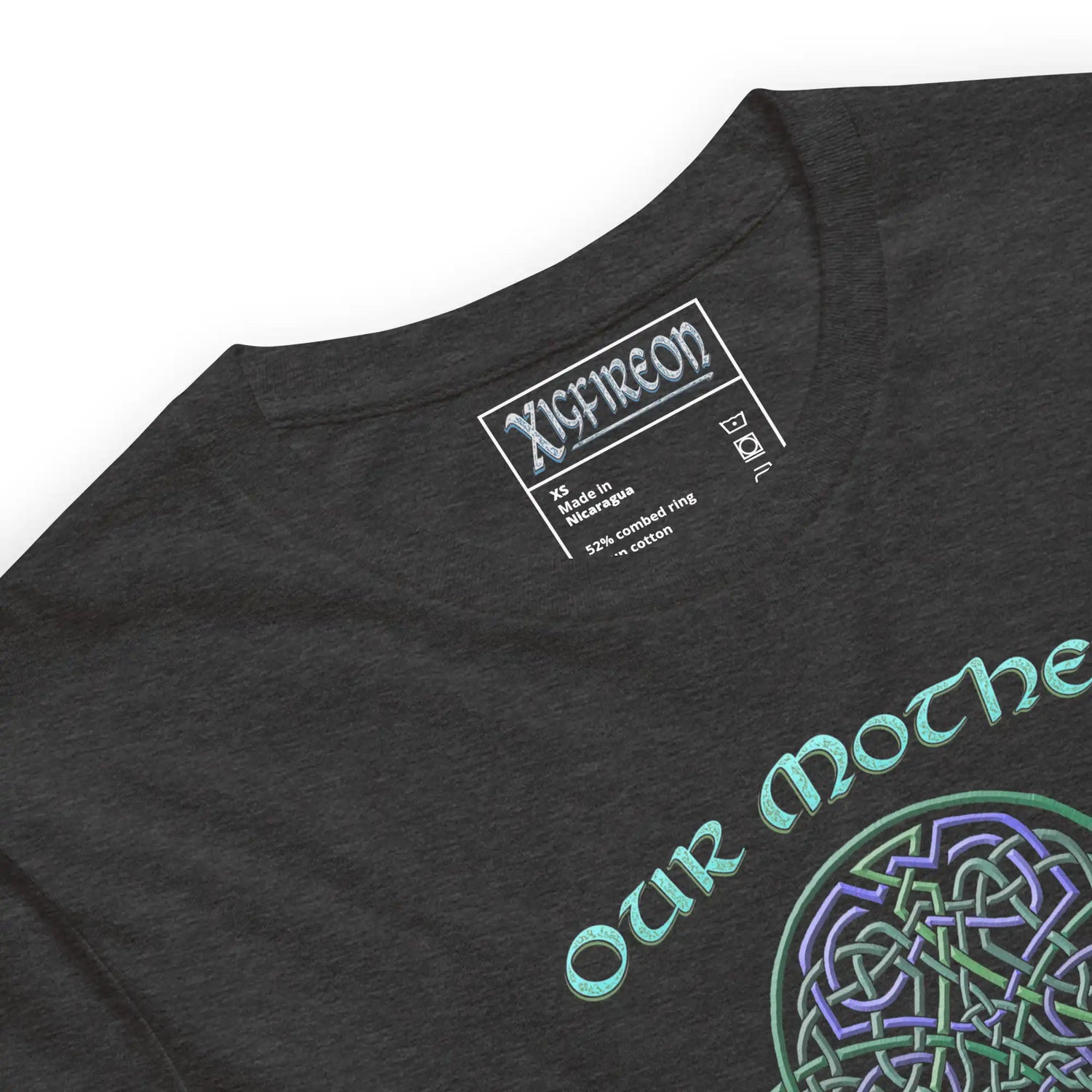 A close up view of a dark grey heather Xigfireon graphic t-shirt featuring the Living Colour iteration of the Reach Of The Spirit Celtic knot design along with a message in a Celtic font: "Our Mother, Cherish Her".