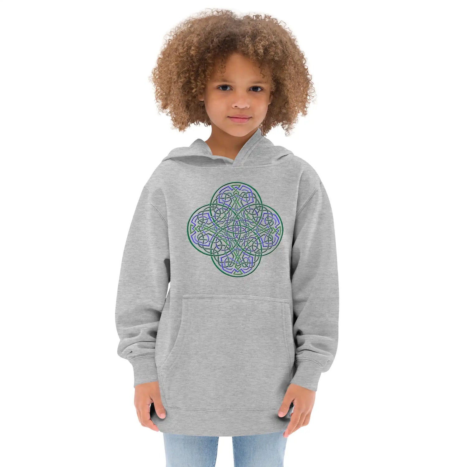 A young girl wearing a kids athletic heather graphic hoodie featuring the Living Colour iteration of the Reach Of The Spirit Celtic knot design.