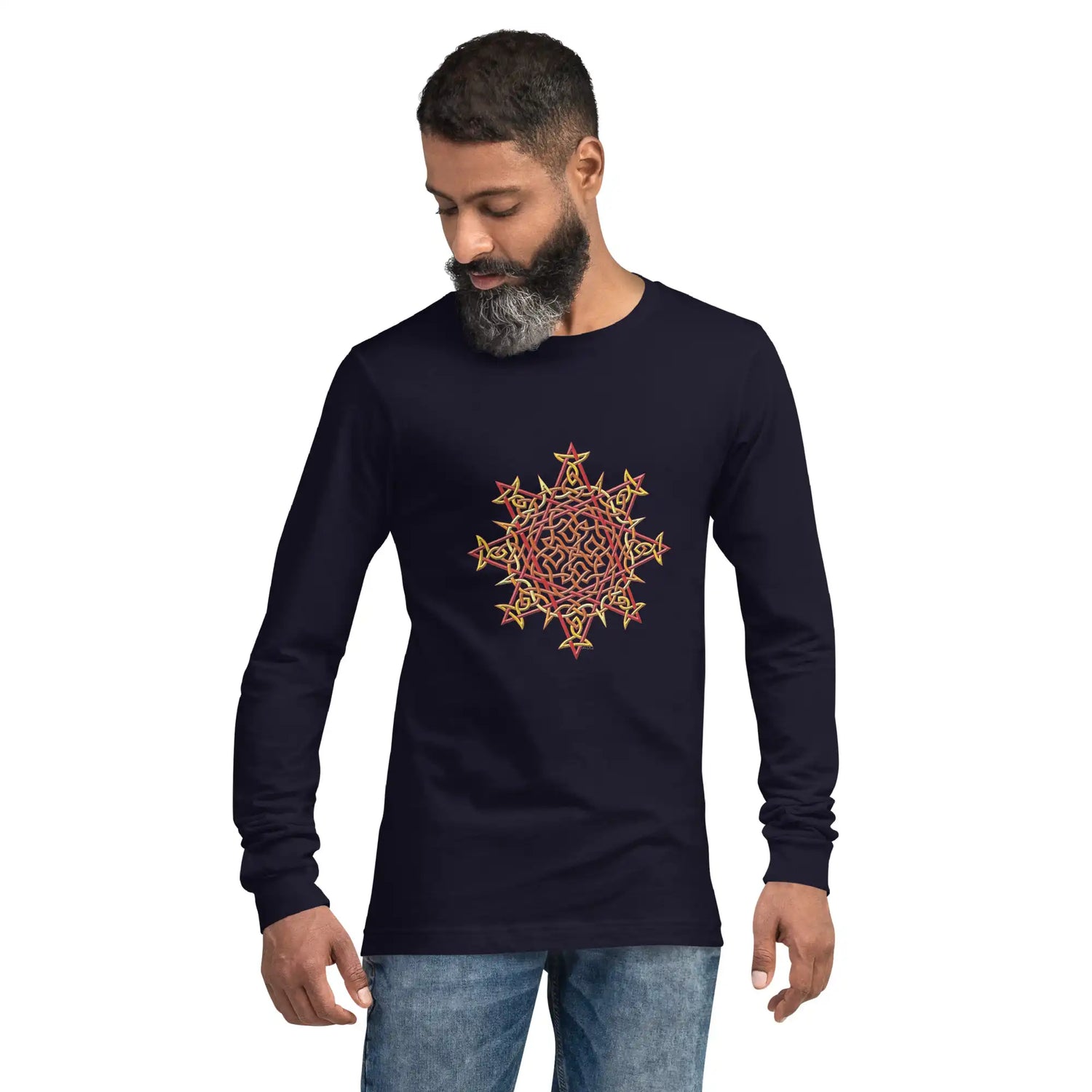 A young man wearing a navy blue Xigfireon long sleeve graphic t-shirt featuring the Fire Colour iteration of the Morning Star Fire Celtic knot design. The Morning Star Fire Celtic knot is a Sun symbol.