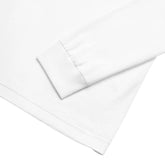 A close-up of the hem on a white Xigfireon long sleeve graphic t-shirt featuring the Fire Colour iteration of the Morning Star Fire Celtic knot design. The Morning Star Fire Celtic knot is a Sun symbol.