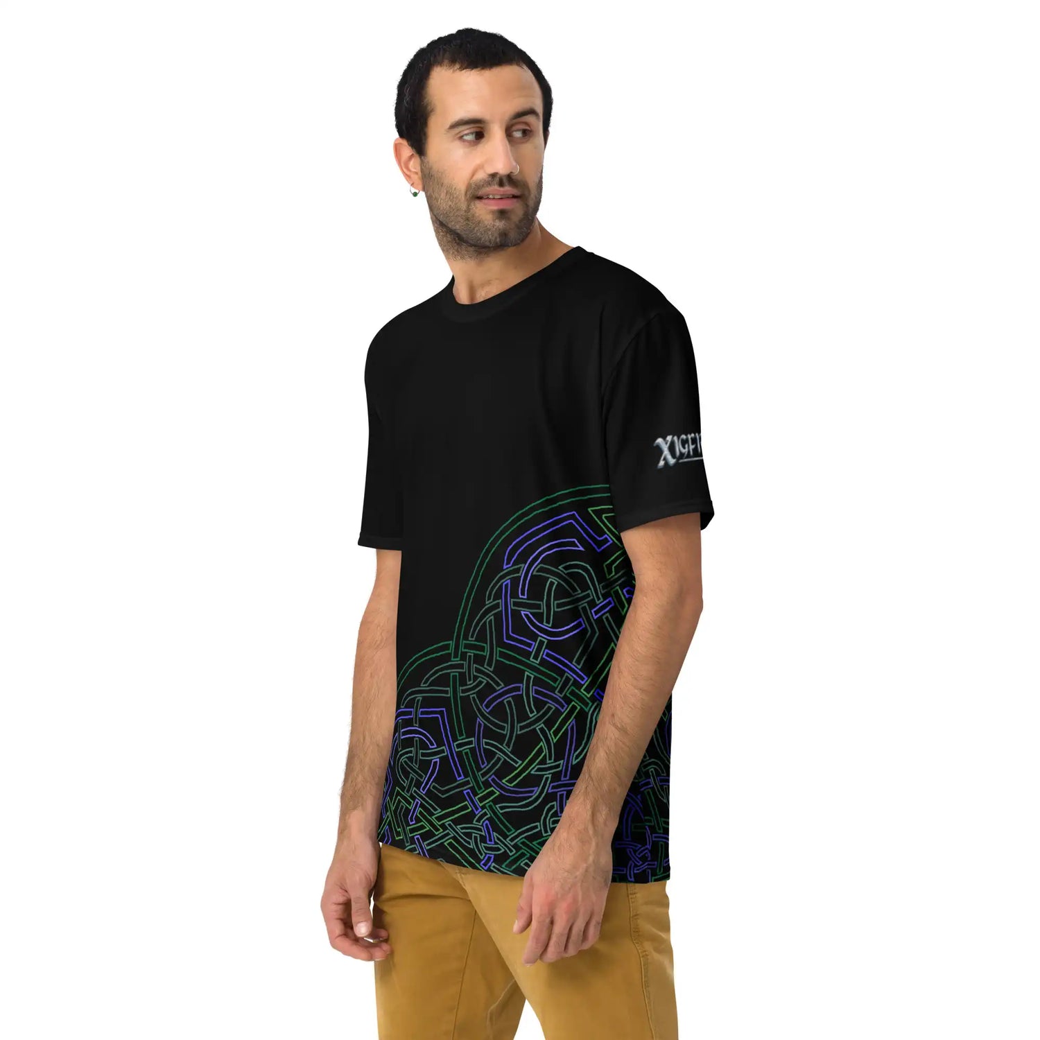 A young man wearing a black Xigfireon graphic mens t-shirt featuring the Living Colour Outline iteration of the Reach Of The Spirit Celtic knot design.
