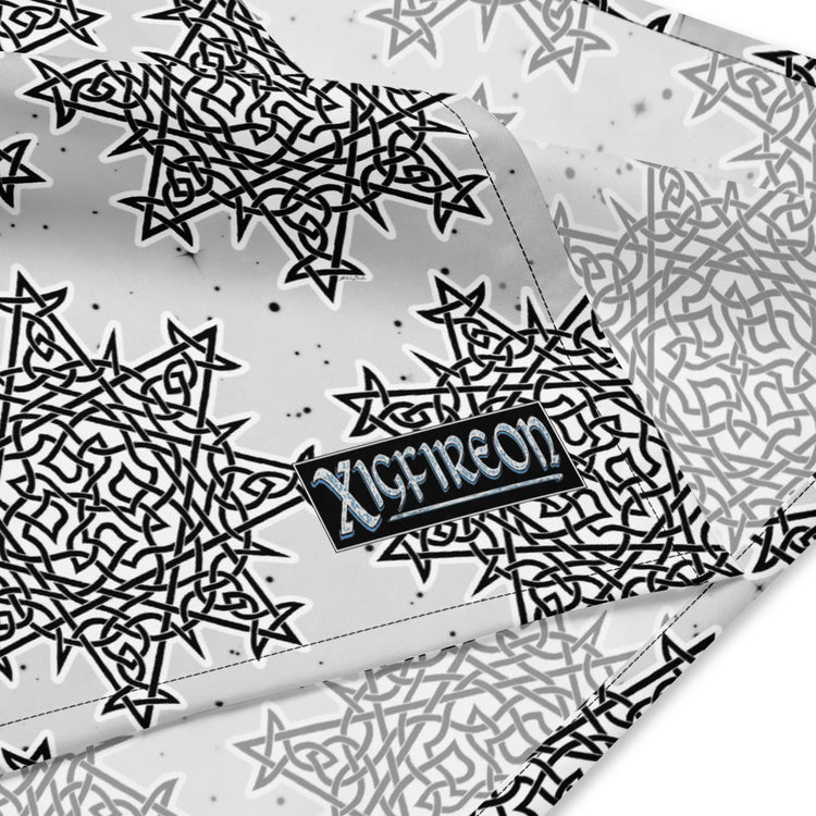 A close up view of the Xigfireon logo on a small sized (17.37 inch x 17.37 inch) `Morning Star Fire` Black and White Solid Cosmos Inverted bandana.