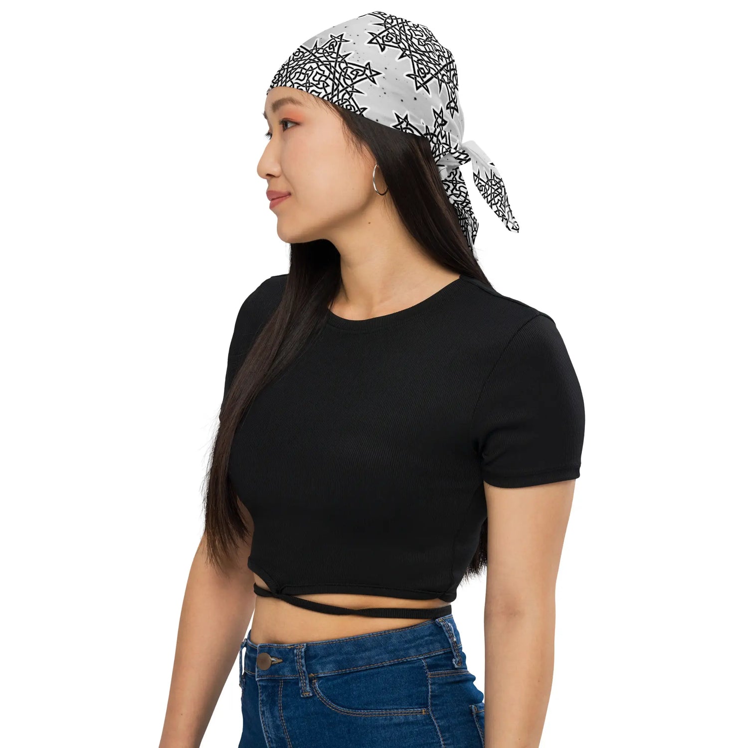 A young woman wearing a Xigfireon bandana adorned with the `Morning Star Fire` Black and White Solid Cosmos Inverted Celtic knot pattern.