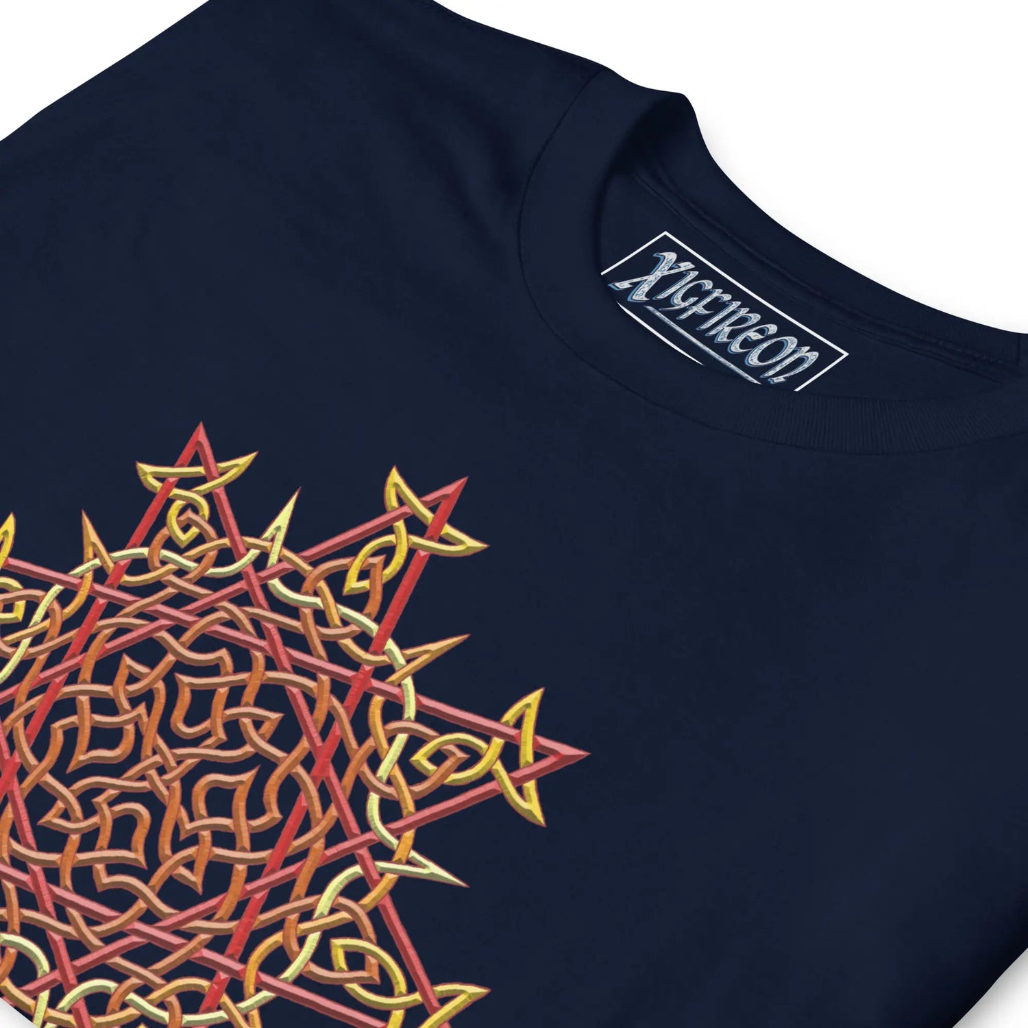 A close-up view of a navy blue Xigfireon graphic t-shirt featuring the Fire Colour iteration of the Morning Star Fire Celtic knot design. The Morning Star Fire Celtic knot symbolizes the Sun.