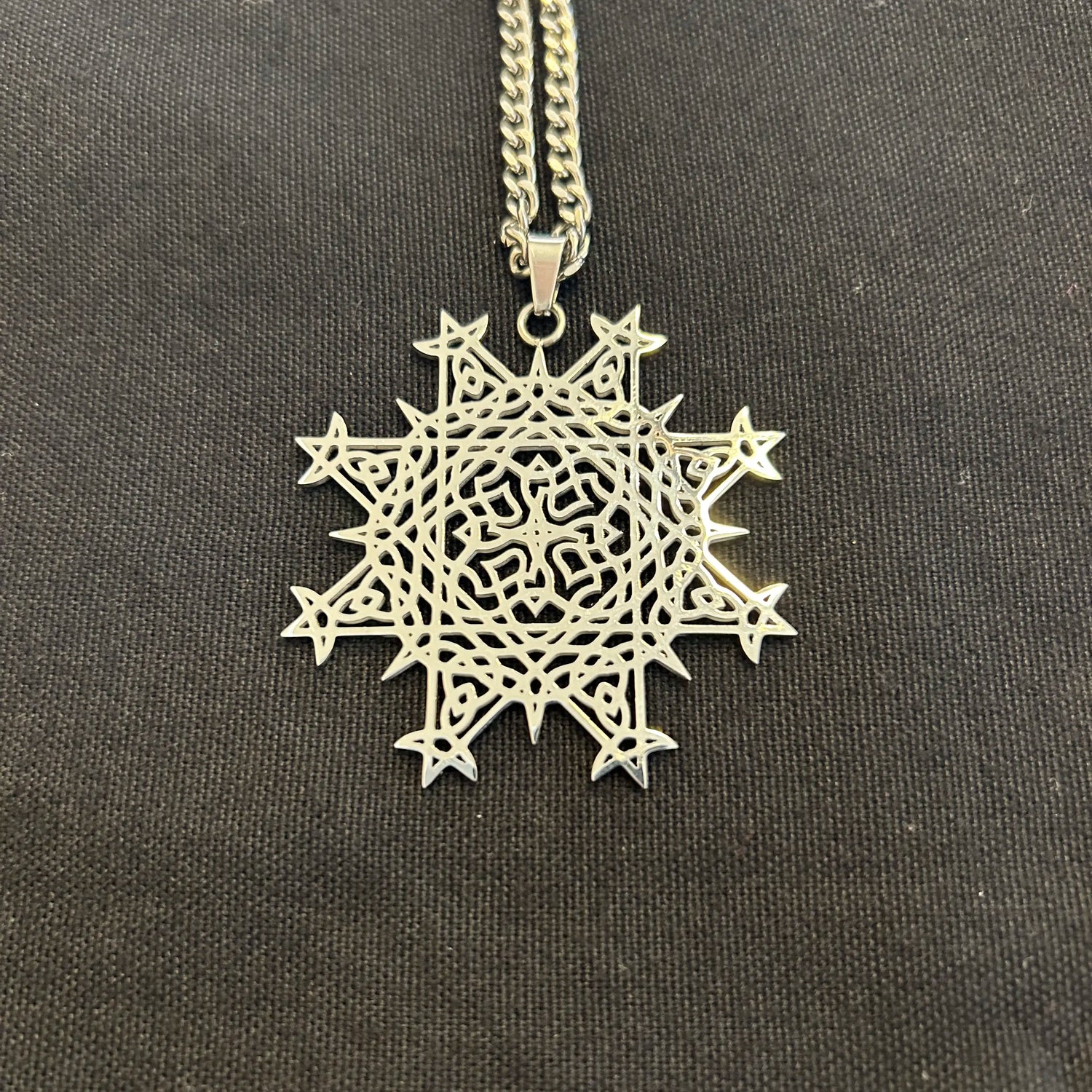 Necklace with a Morning Star Fire Celtic knot pendant in flat stainless steel by Xigfireon.